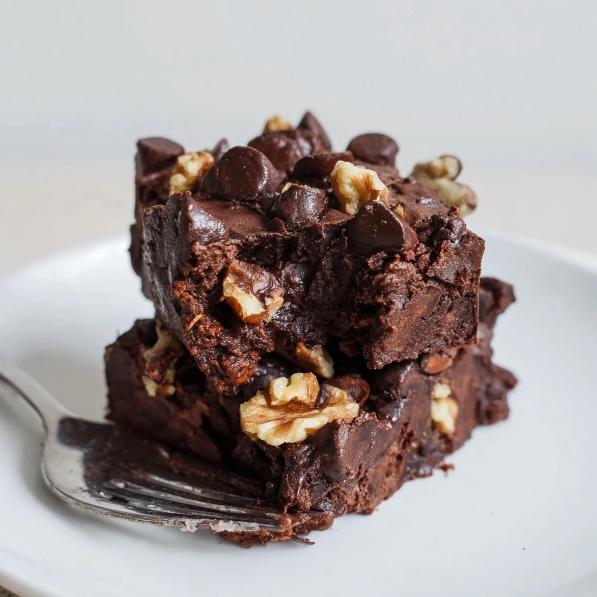 Rich, fudgy zero-waste brownies topped with dark chocolate chips and nuts.  
