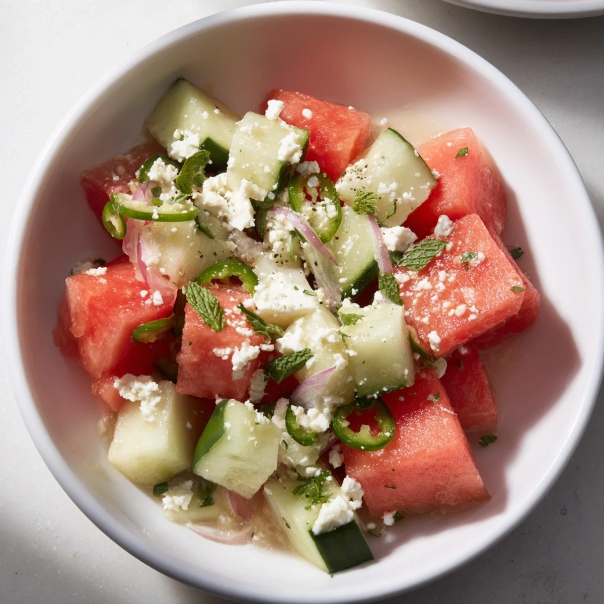 Fresh Cucumber and Watermelon Hot Girl Salad with crumbled feta and a zesty lime dressing.
