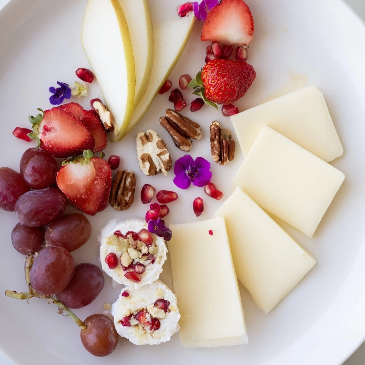 Rose Garden Romantic Platter: A vibrant display with fruits, cheeses, edible flowers, and baguette slices for sharing.