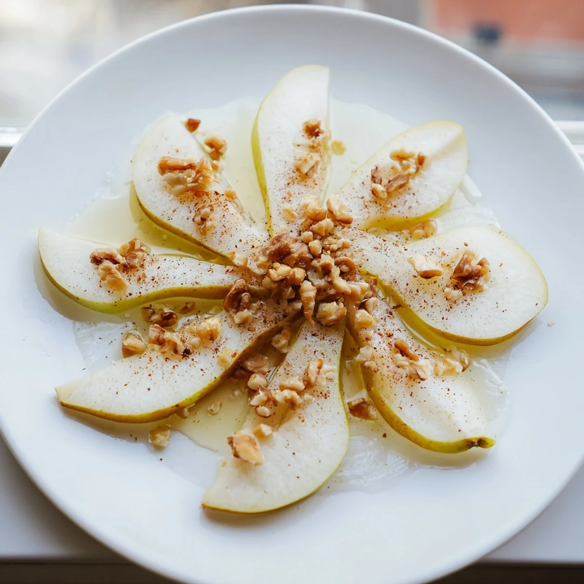 Close-up of pear slices drizzled with honey, ready to eat, a quick and easy snack.