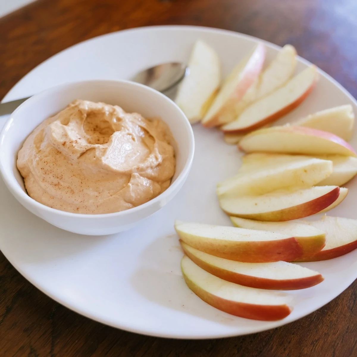 Crisp apple slices ready for dipping in creamy peanut butter with this quick Apple Slices recipe.