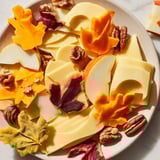 A beautiful display of Thanksgiving Leaf Fall, cheese and crackers arranged like falling autumn leaves.