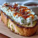 Savory vegetarian bruschetta appetizer served on a rustic wooden board with fresh basil garnish for a party.
