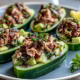 Quick 10-Minute Tuna Avocado Cucumber Boats served chilled with lemon and herbs.