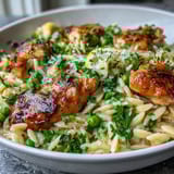 Tender chicken, zesty lemon, and sweet peas in a creamy orzo dish cooked in one pot