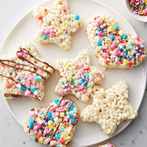 Warm, gooey cookie cutter shaped Rice Krispies treats, ready to be decorated with colorful sprinkles.