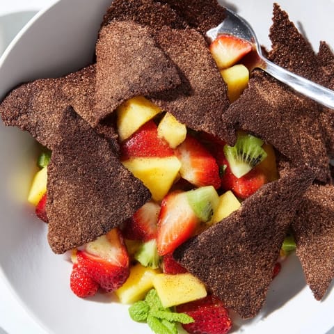 Sweet and crispy dessert chips with refreshing fruit salsa, perfect for sharing.  