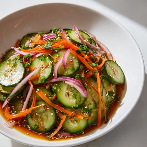 Vibrant Cucumber Salad Remix with fresh cucumbers and zesty Asian-inspired flavors.  