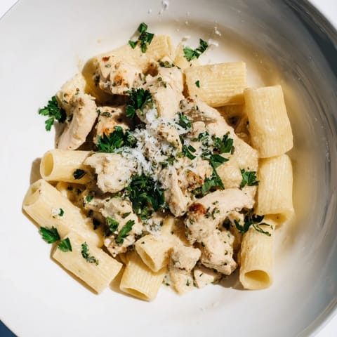 A close-up of steaming, delicious Creamy Garlic Parmesan Chicken Rigatoni, ready to be enjoyed.