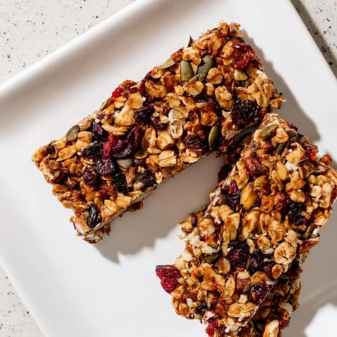 Homemade Roasted Pumpkin Seed & Cranberry Granola Bars: a delicious, healthy snack with crispy edges.