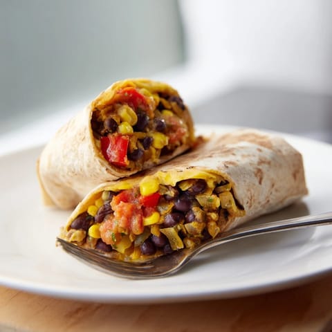 Steaming hot freezer-friendly burritos, filled with beans, rice, and cheese, ready in minutes for dinner.