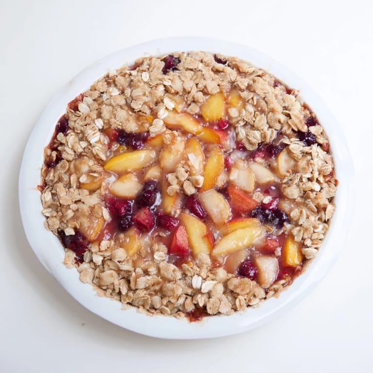 Crumbly oat topping covers a filling of frozen fruit in this easy, flavorful Fruit Crisp recipe.