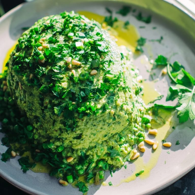 This satisfying Green Pea & Spinach Pasta features bright green pasta and a sprinkle of lemon zest on top.
