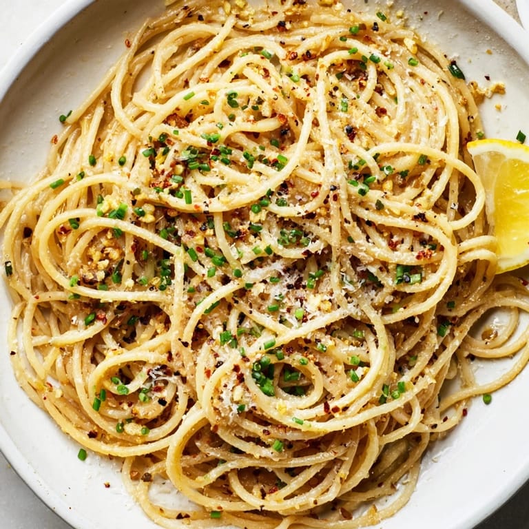 Close-up of miso butter pasta: perfectly cooked spaghetti glistening with savory miso, ready to eat.