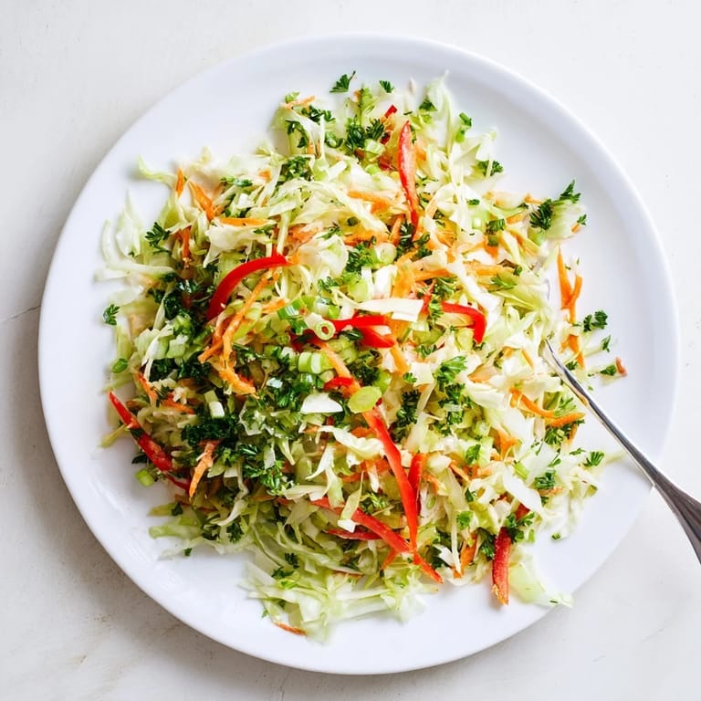 Zesty fermented cabbage Sauerkraut Slaw pairing perfectly with grilled sausages, showcasing a vibrant, probiotic-rich German side dish.